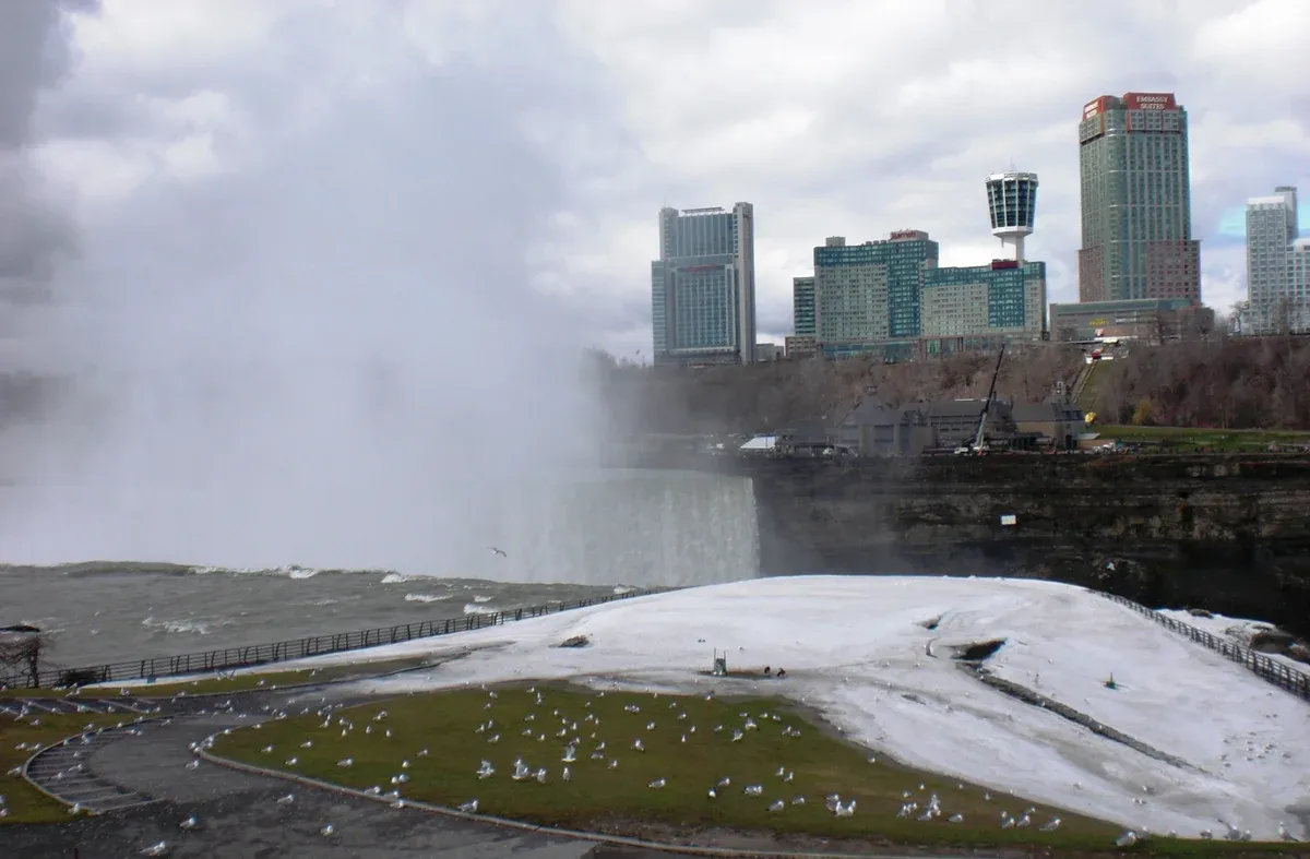 Snow and ice along the riverbank at Niagara Falls in winter on a Niagara Falls tour from NYC, New York