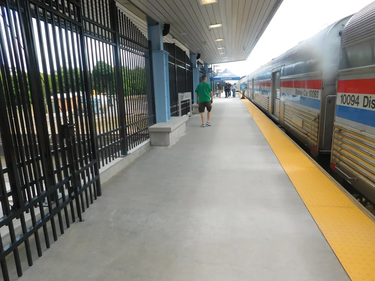 A passenger on the platform at the Niagara Falls Amtrak station on a Niagara Falls tour from NYC, New York