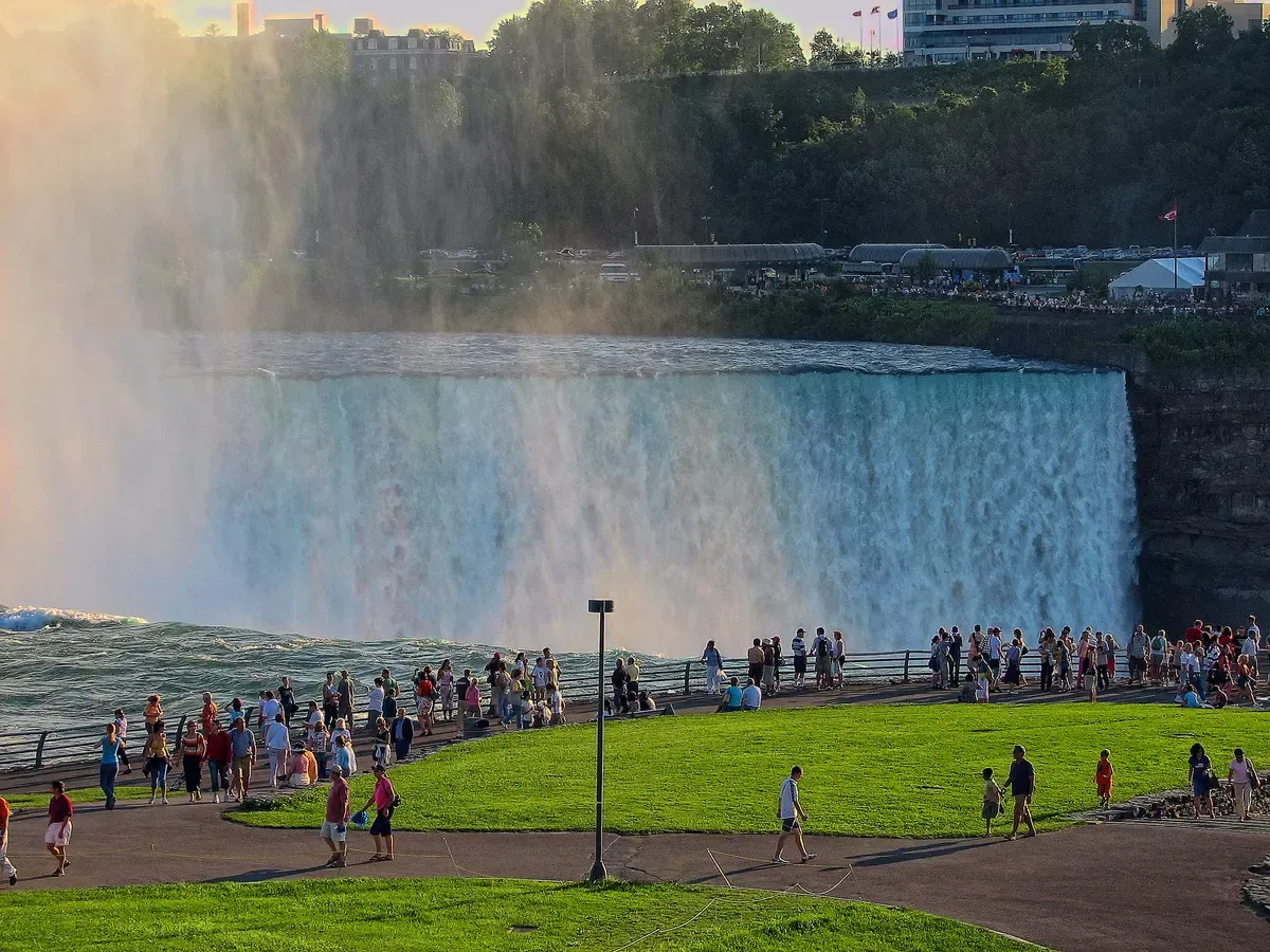 Visitors at the railing at Terrapin Point beside Horseshoe Falls on a Niagara Falls tour from NYC, New York