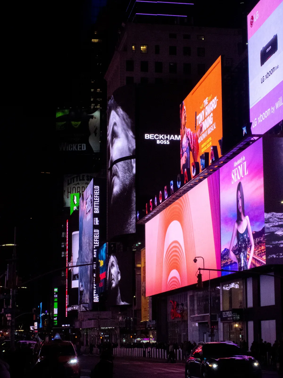 Illuminated billboards on 7th Avenue in Times Square at night on a Niagara Falls tour from NYC, New York